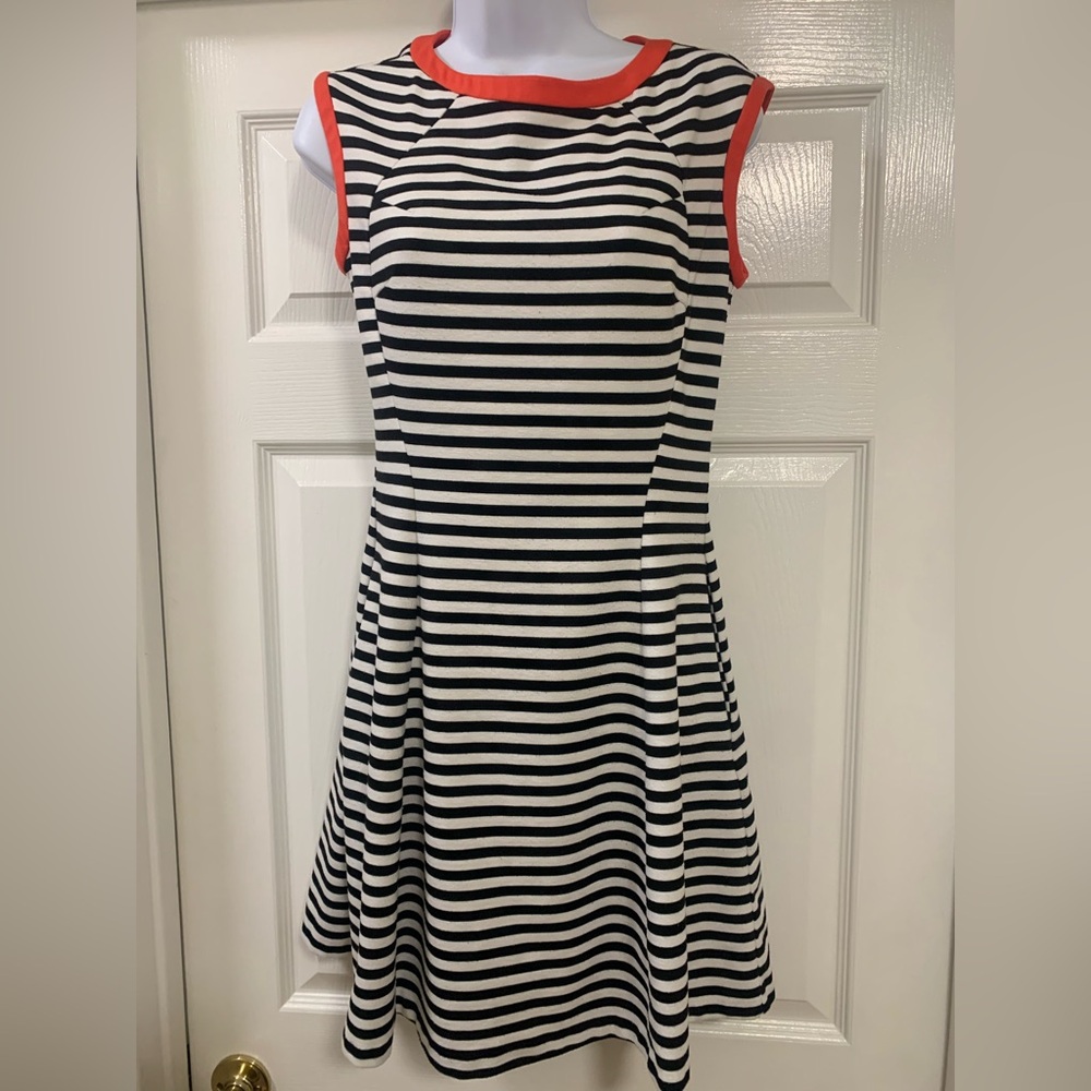 Valerie Steven’s black and white striped dress with red  trim, fit and flare